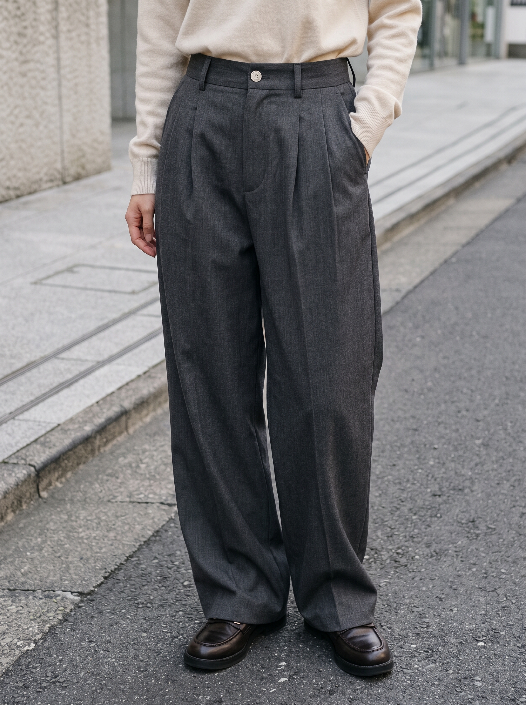Editorial portrait of an adult model wearing Aelfric Eden Wide Leg Dress Pants Mens Womens Baggy Pleated Trousers Vintage Button Front High Waisted Y2K Streetwear Pants