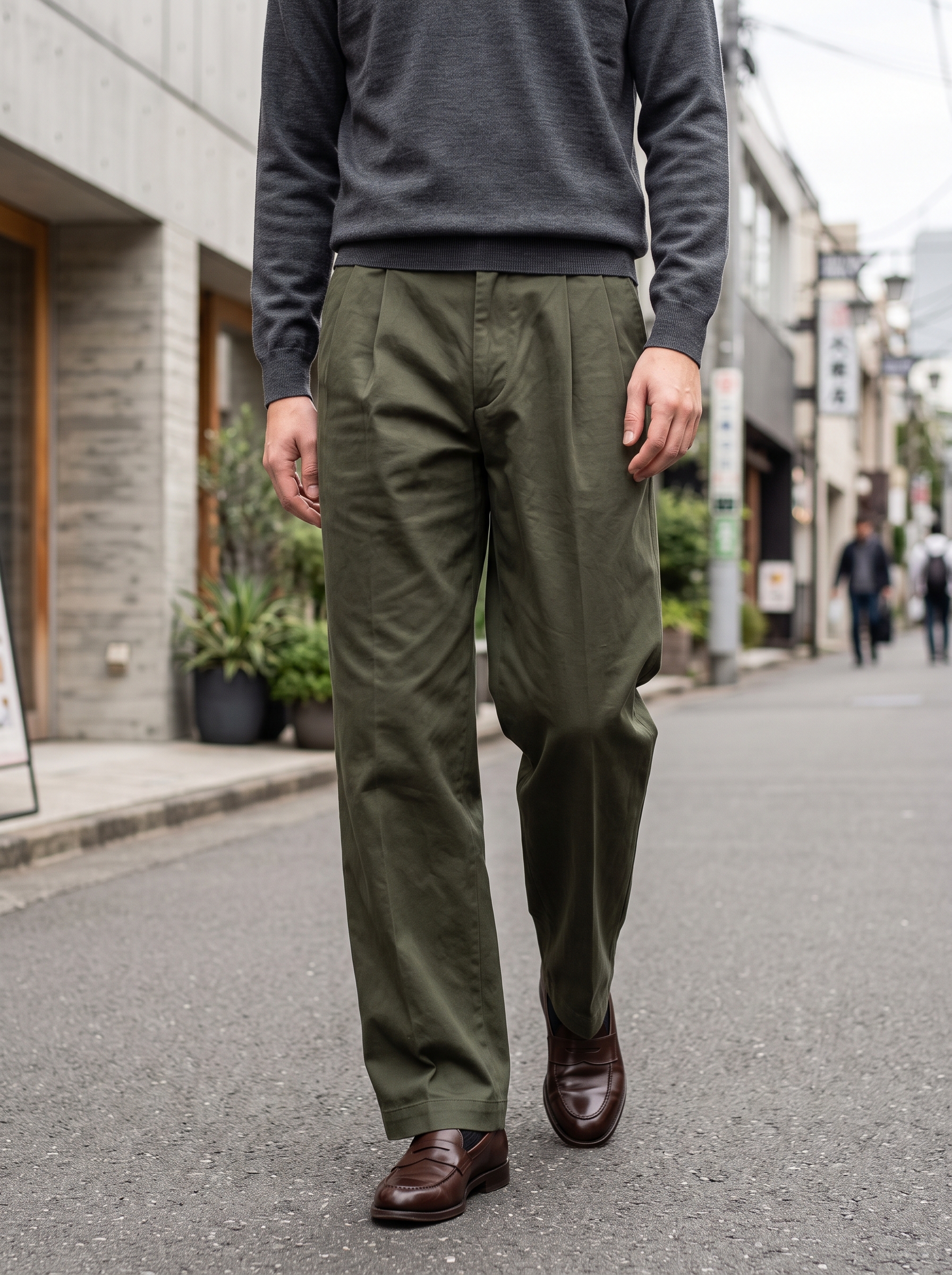 Editorial portrait of an adult male model wearing Men's Baggy Casual Dress Pants Old Money Pleated Wide Leg Vintage Relaxed Fit Lightweight Slacks Work Office Trousers
